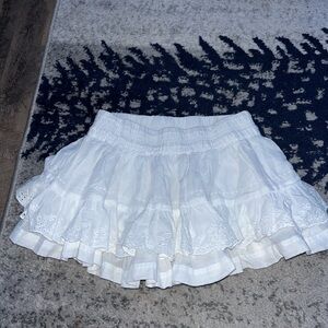 white mini skirt w floral embroidery